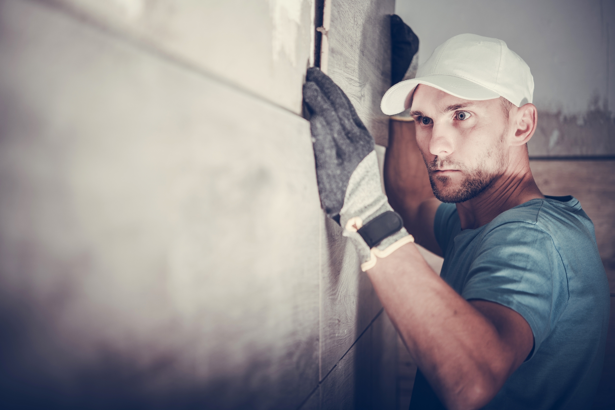Contractor installing bathroom tile