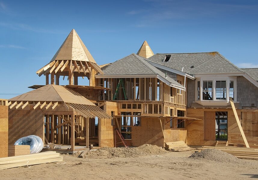 Home addition under construction with plywood structure half finished